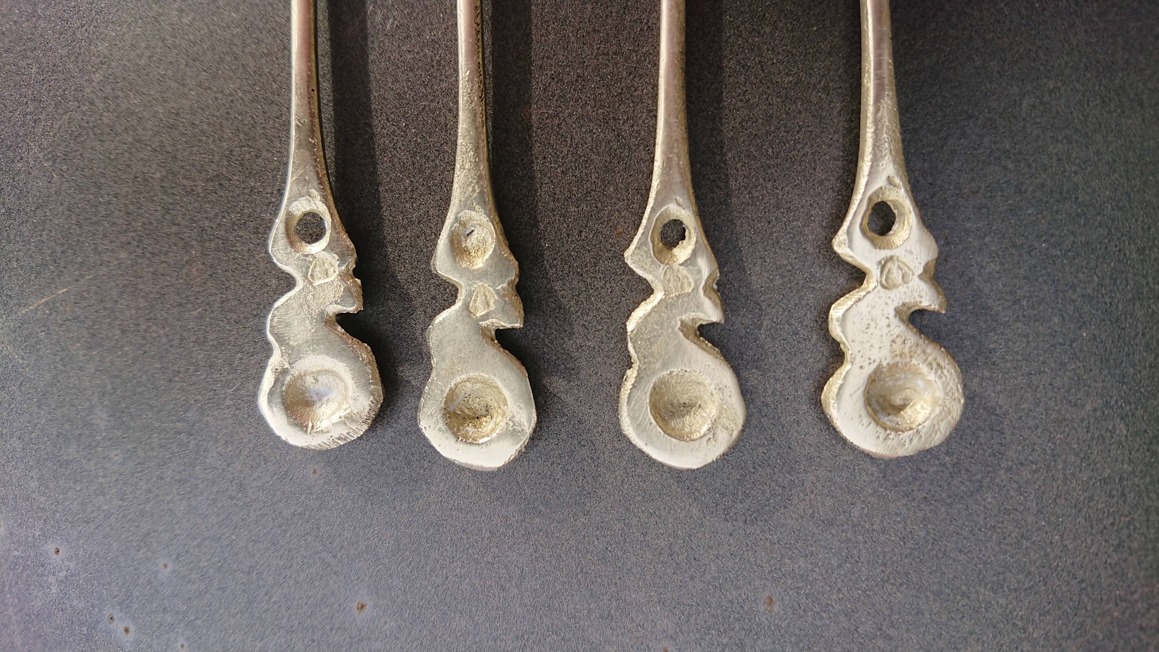 Small golden spoons with punch