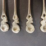 Small golden spoons with punch