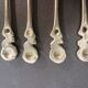 Small golden spoons with punch