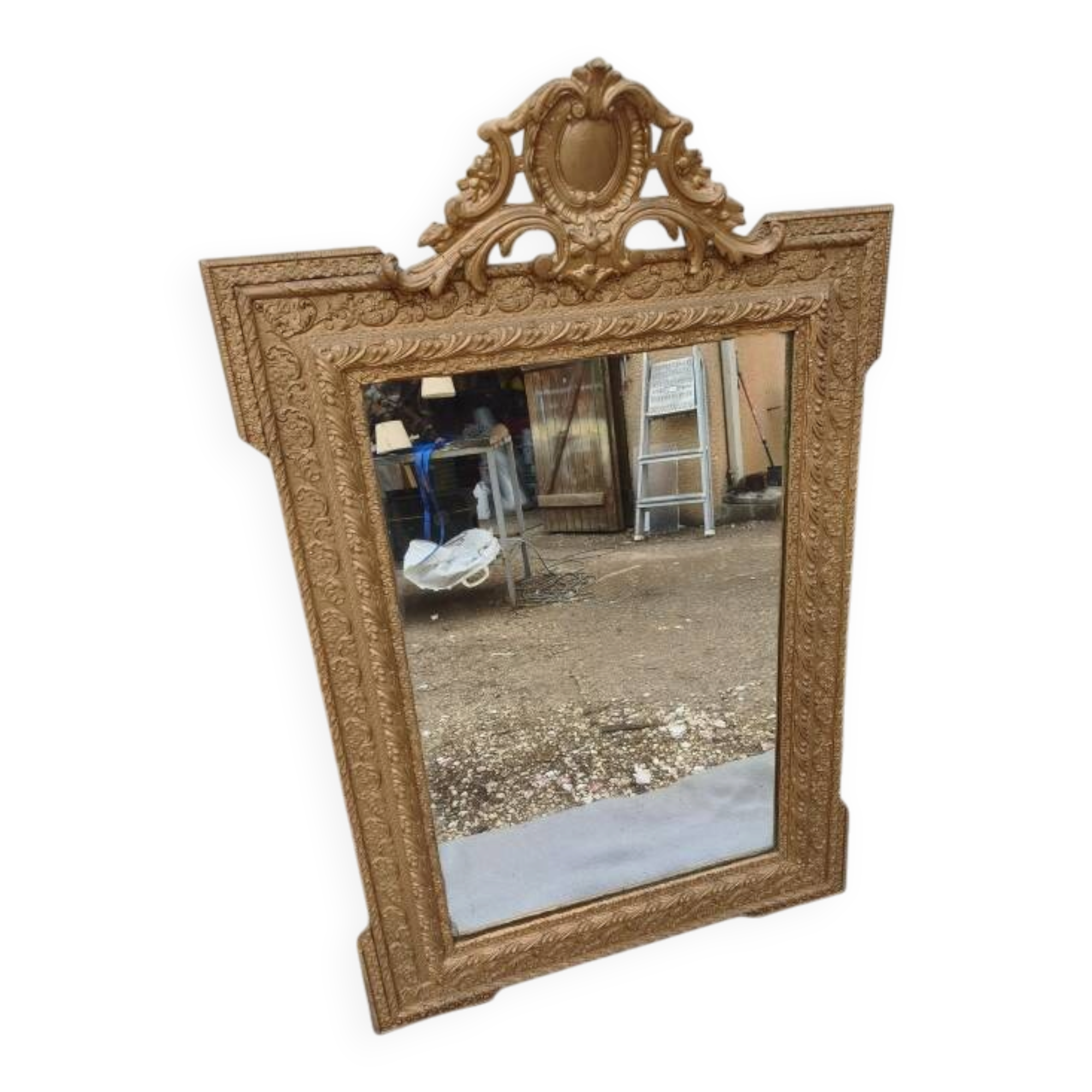 19th-century mirror in gilded wood and stucco.