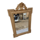 19th-century mirror in gilded wood and stucco.