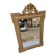 19th-century mirror in gilded wood and stucco.