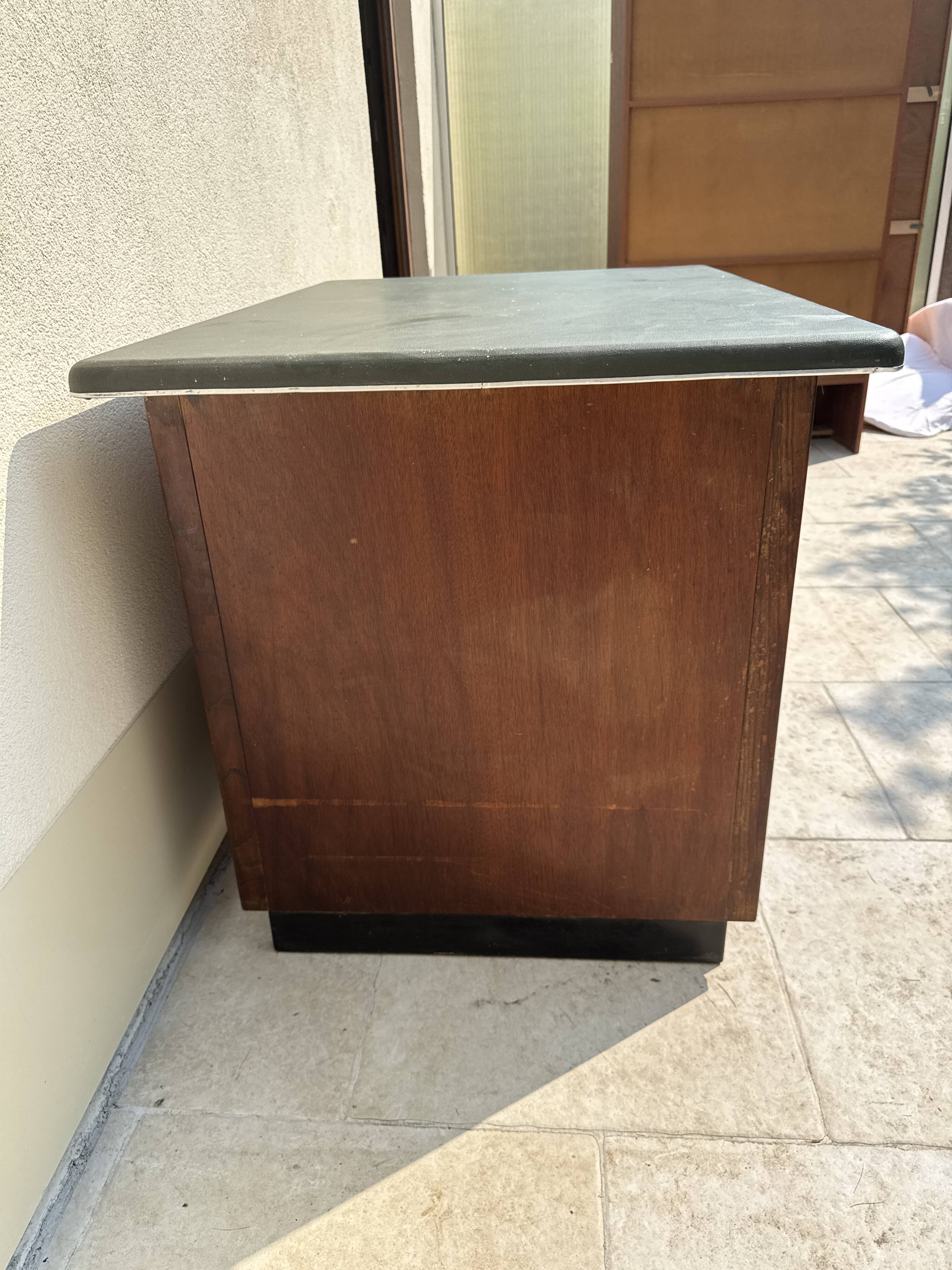 Modernist desk in wood and green moleskin upholstery