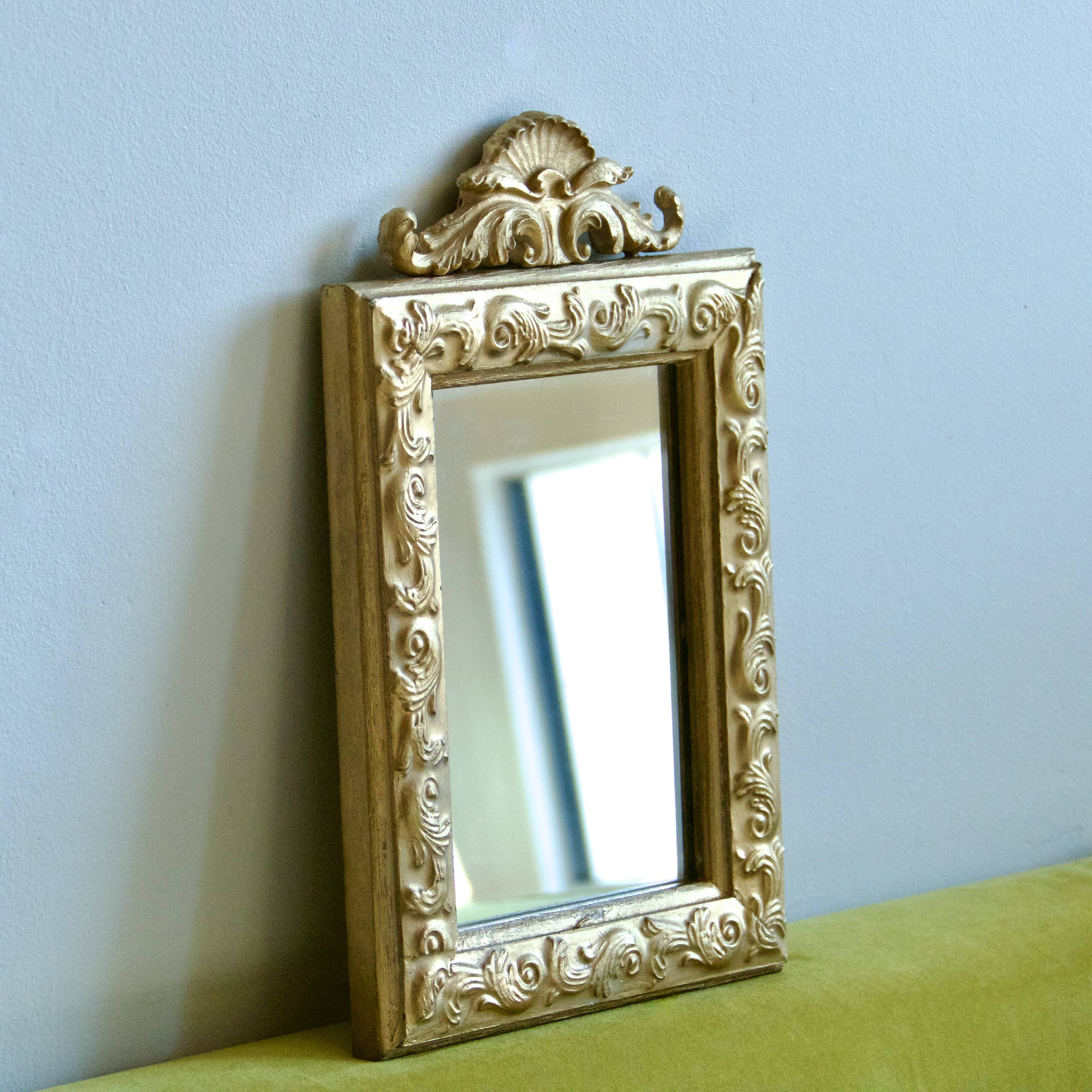 Antique gilded shell mirror with arabesque moldings