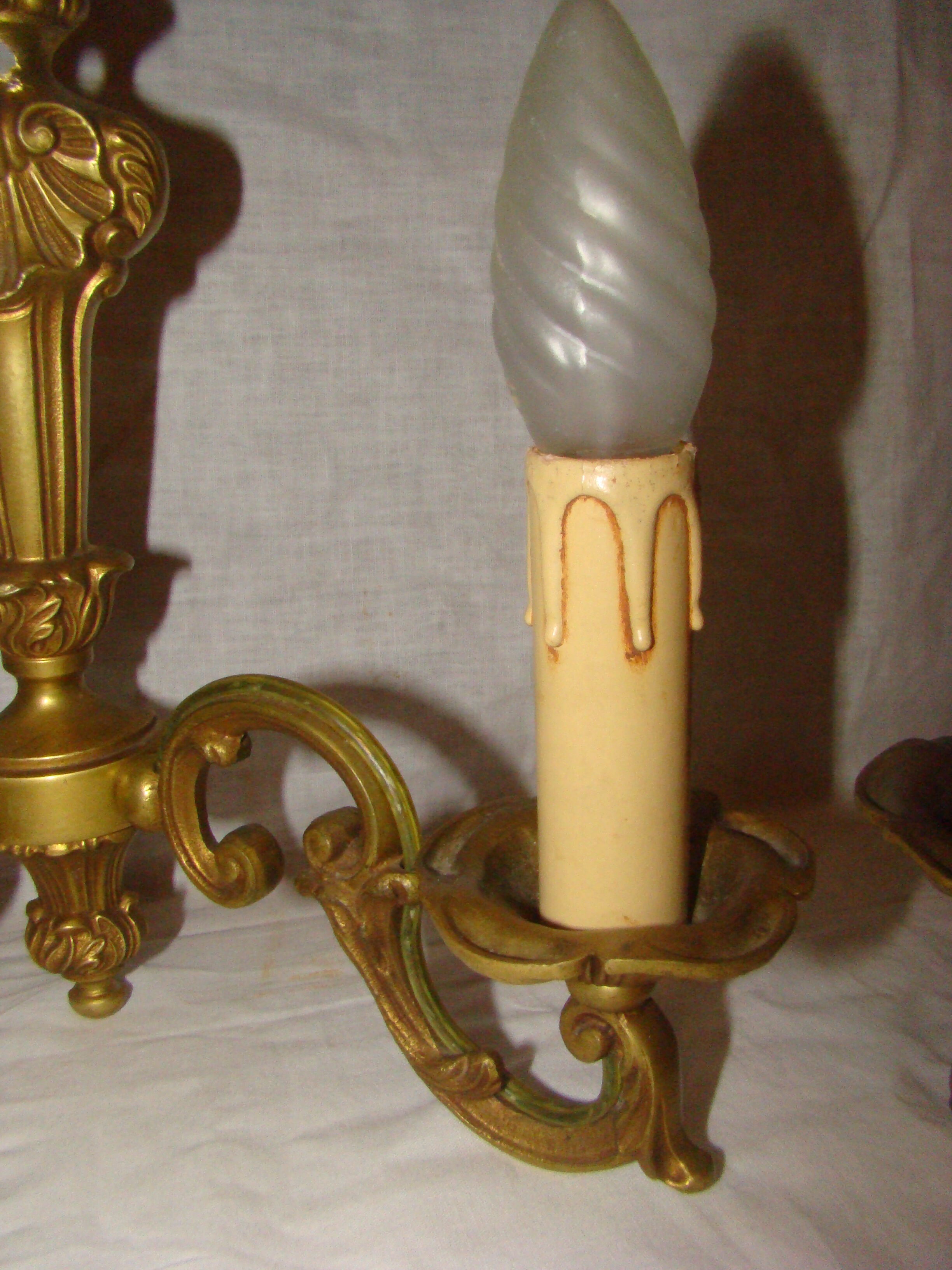 pair of bronze wall lights with 2 arms