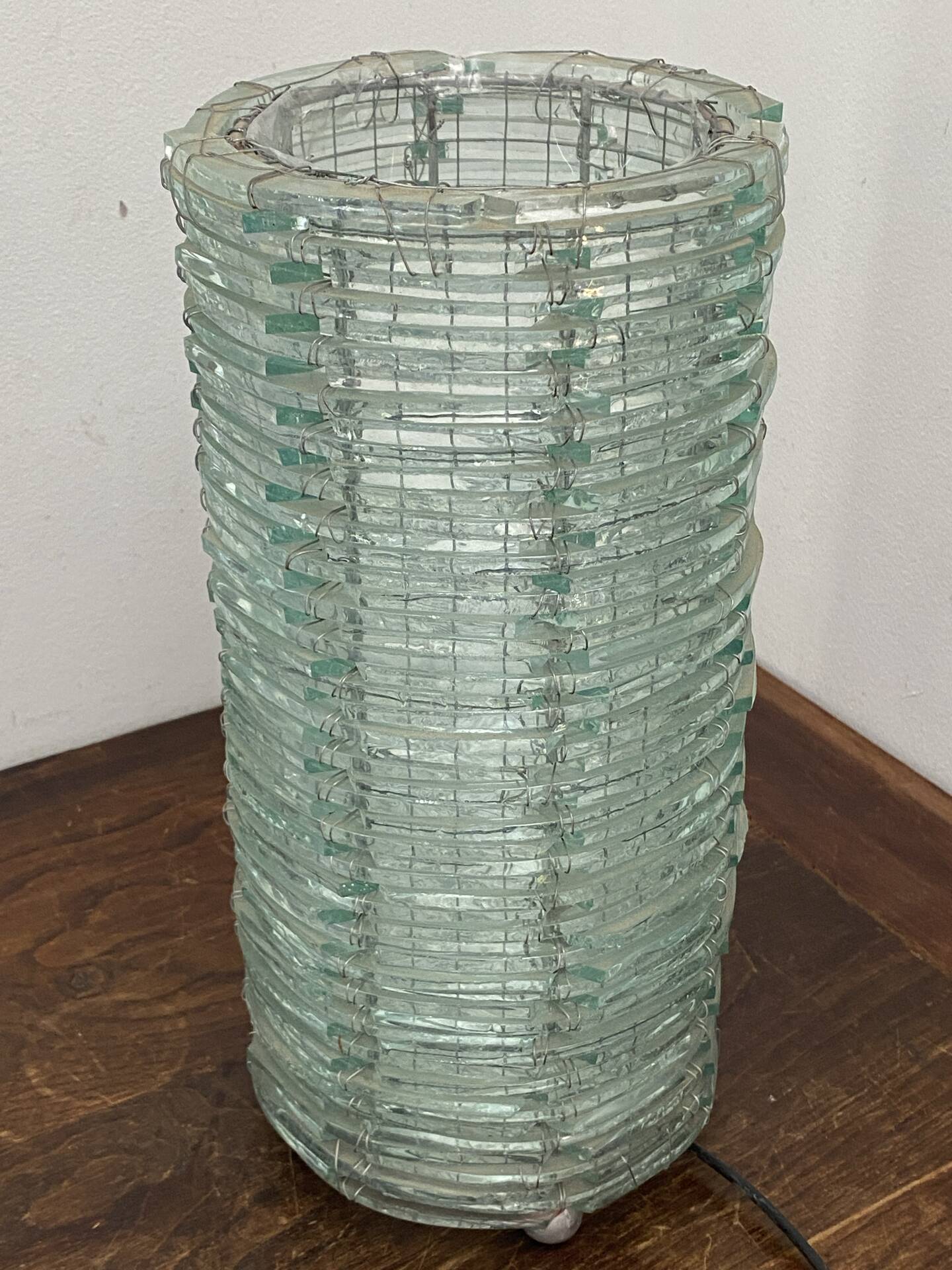 Blue-tinted glass lamp and wire.