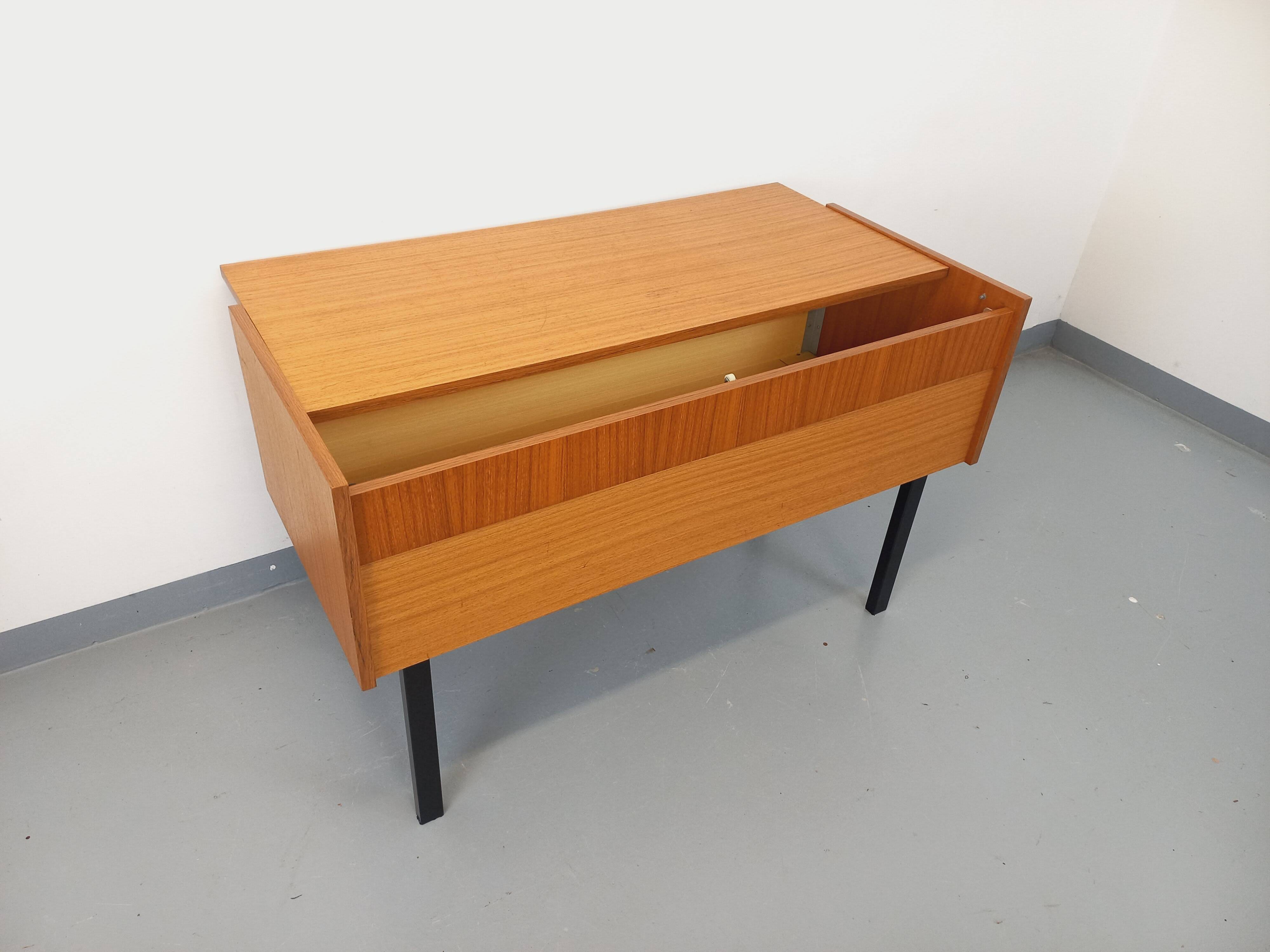 Vintage teak and black metal storage unit / chest on legs from the 70s