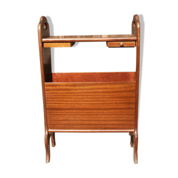 Table with drawers for magazines and glass top.