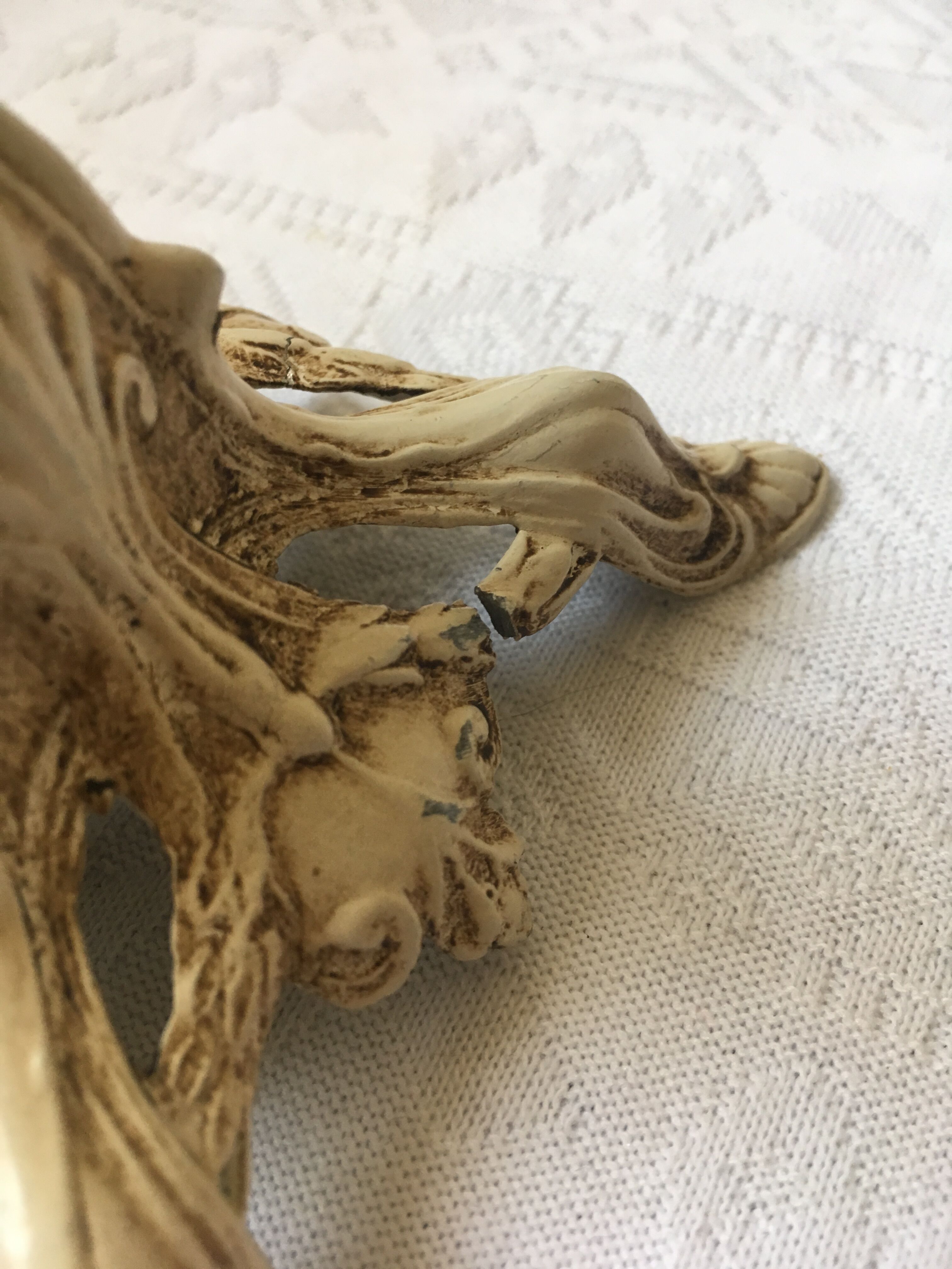 Large candle holder in patinated white painted metal