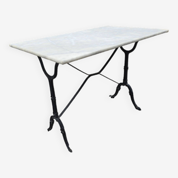 Bistro table with marble top and cast iron base