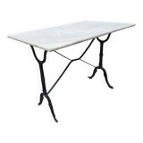 Bistro table with marble top and cast iron base