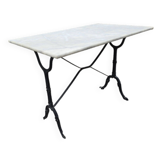 Bistro table with marble top and cast iron base