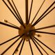 Sputnik-shaped chandelier in patinated gold-plated brass and black lacquer. Contemporary.