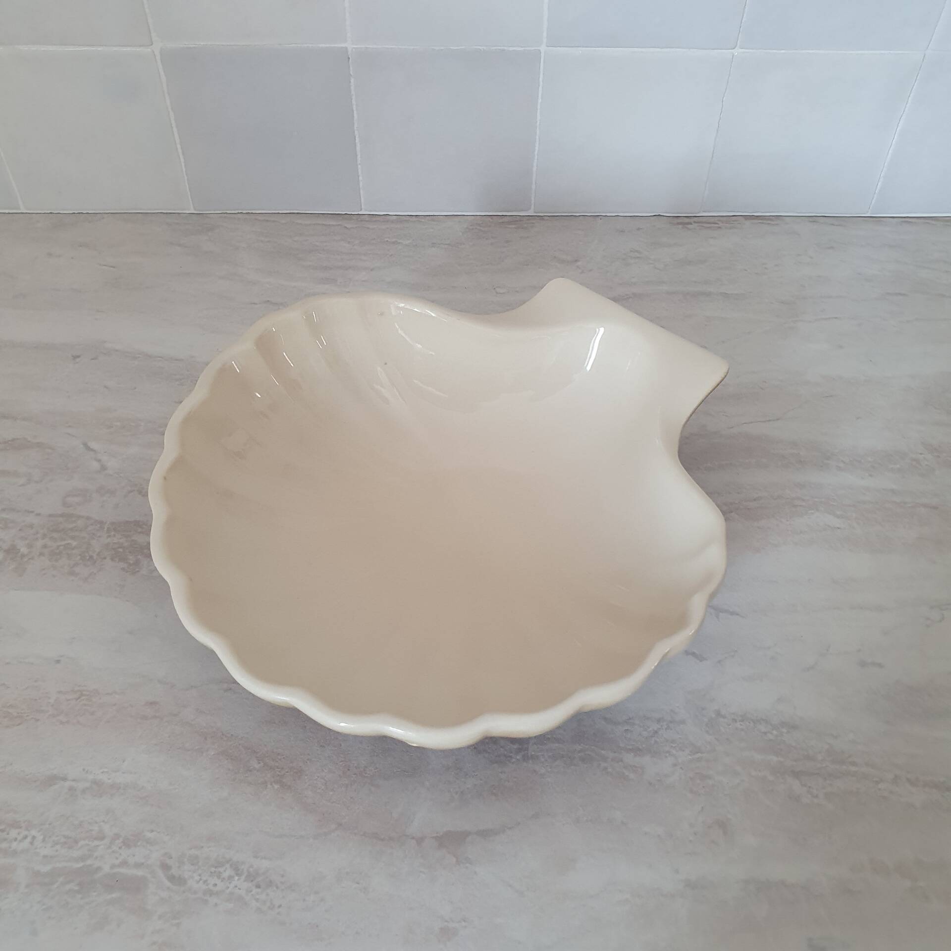 Brown and white ceramic shell bowl