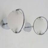 Pair of Italian Fontana Arte Nobi wall lights in chrome metal and satin glass.