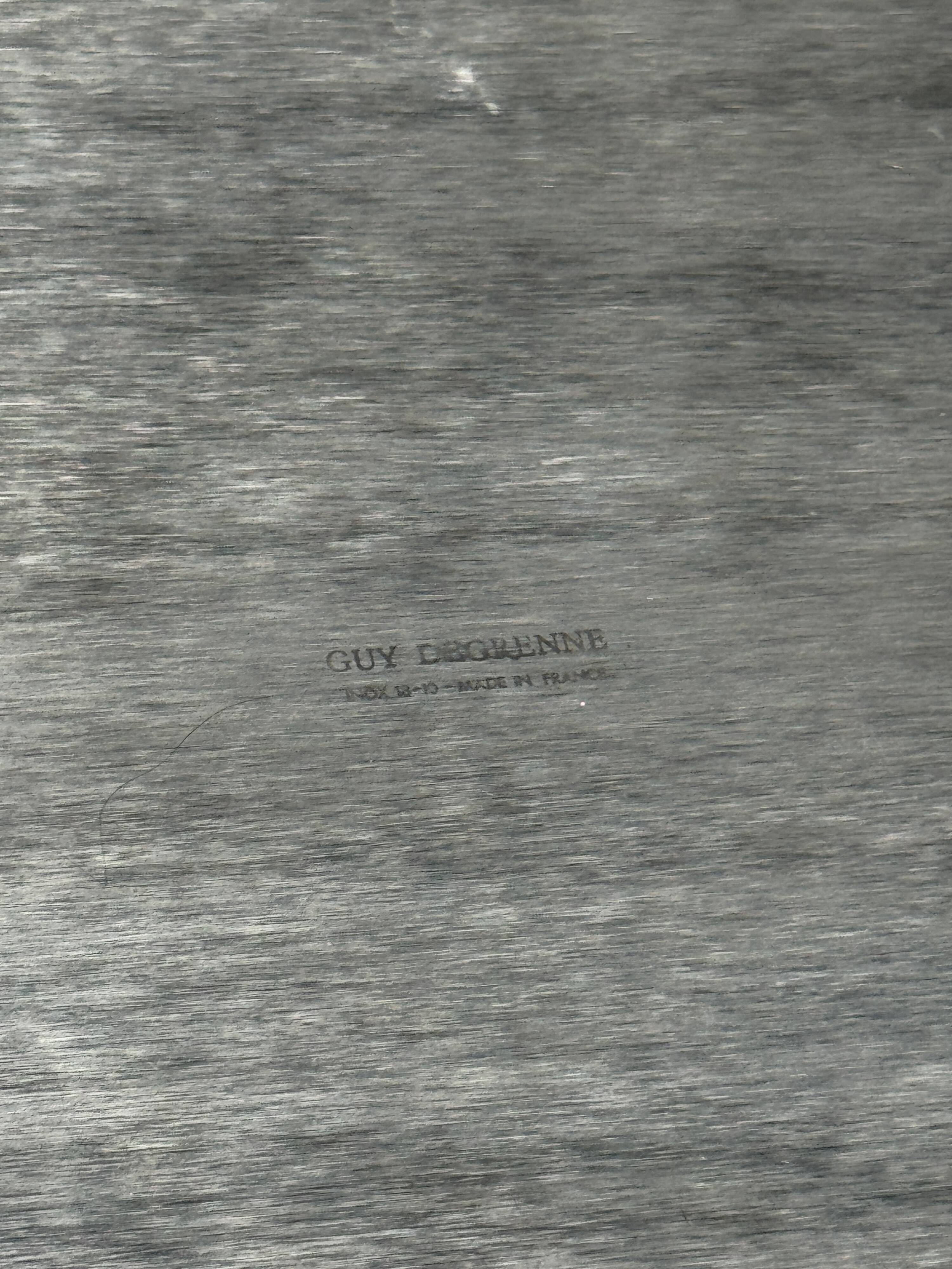 Guy Degrenne silver stainless steel serving tray with an eventful shape