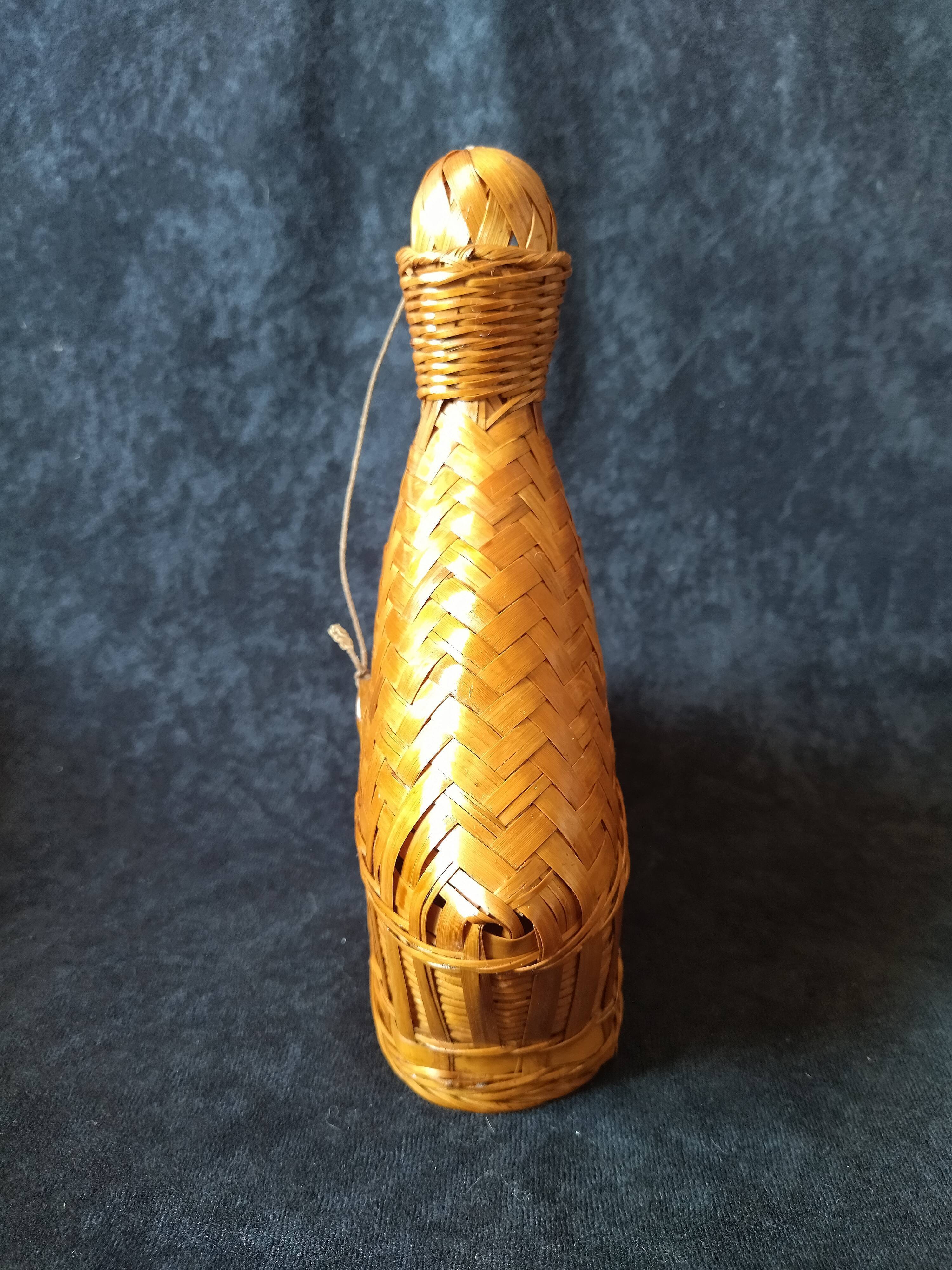 Vintage wicker and braided bamboo bottle