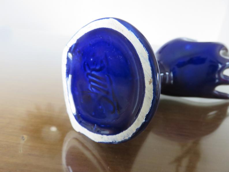Signed blue ceramic soliflore hand