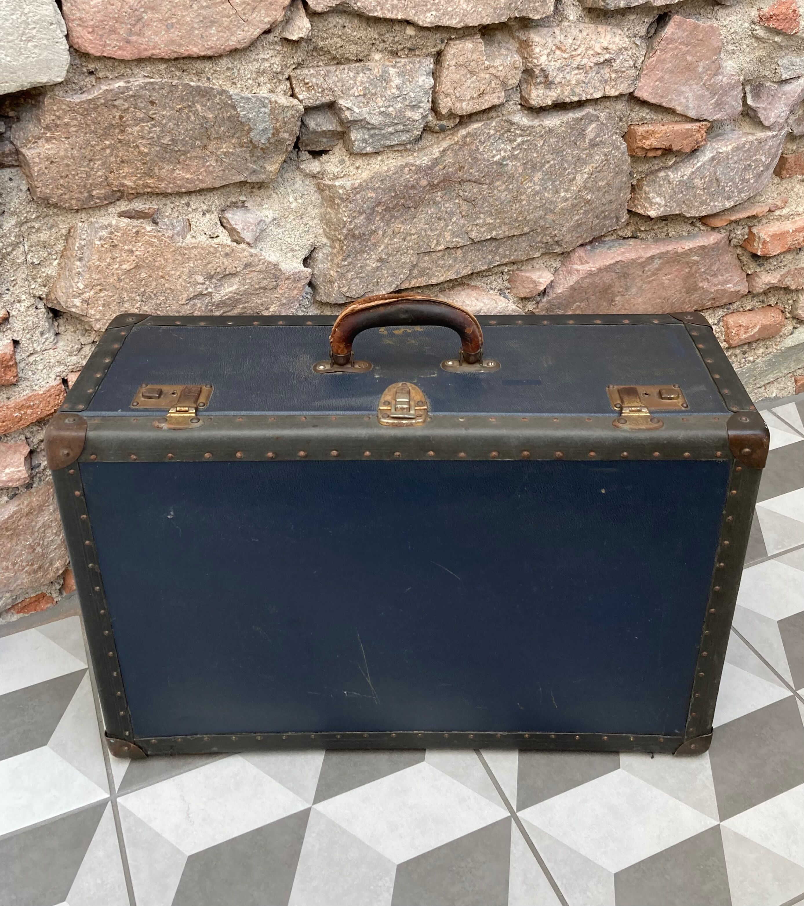 Midnight blue suitcase of representative 30s