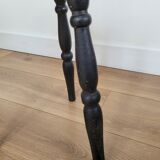Black wooden tripod stool