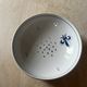 Fruit strainer in earthenware, Pornic, lily flower design.