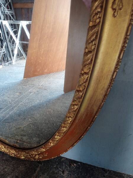 Oval mirror 134cm wood and gilded stucco early 20th century