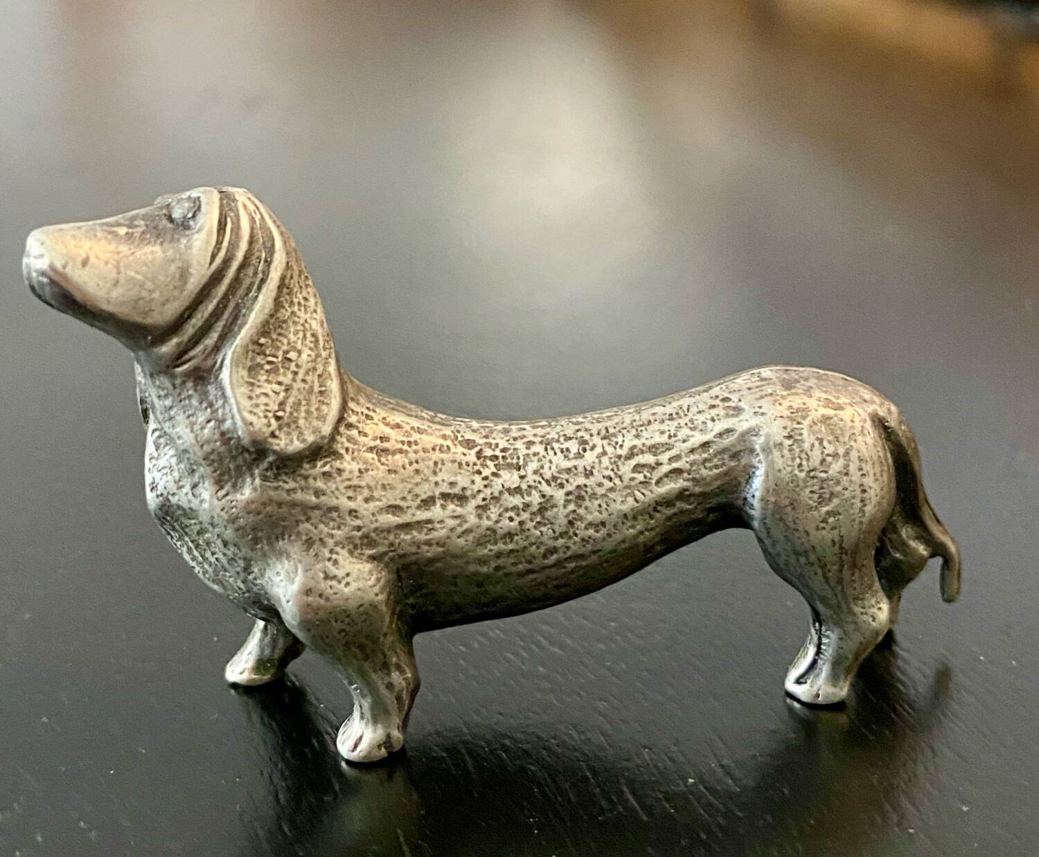 12 old dog-shaped Etains du Manoir knife holders