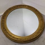Golden oval mirror
