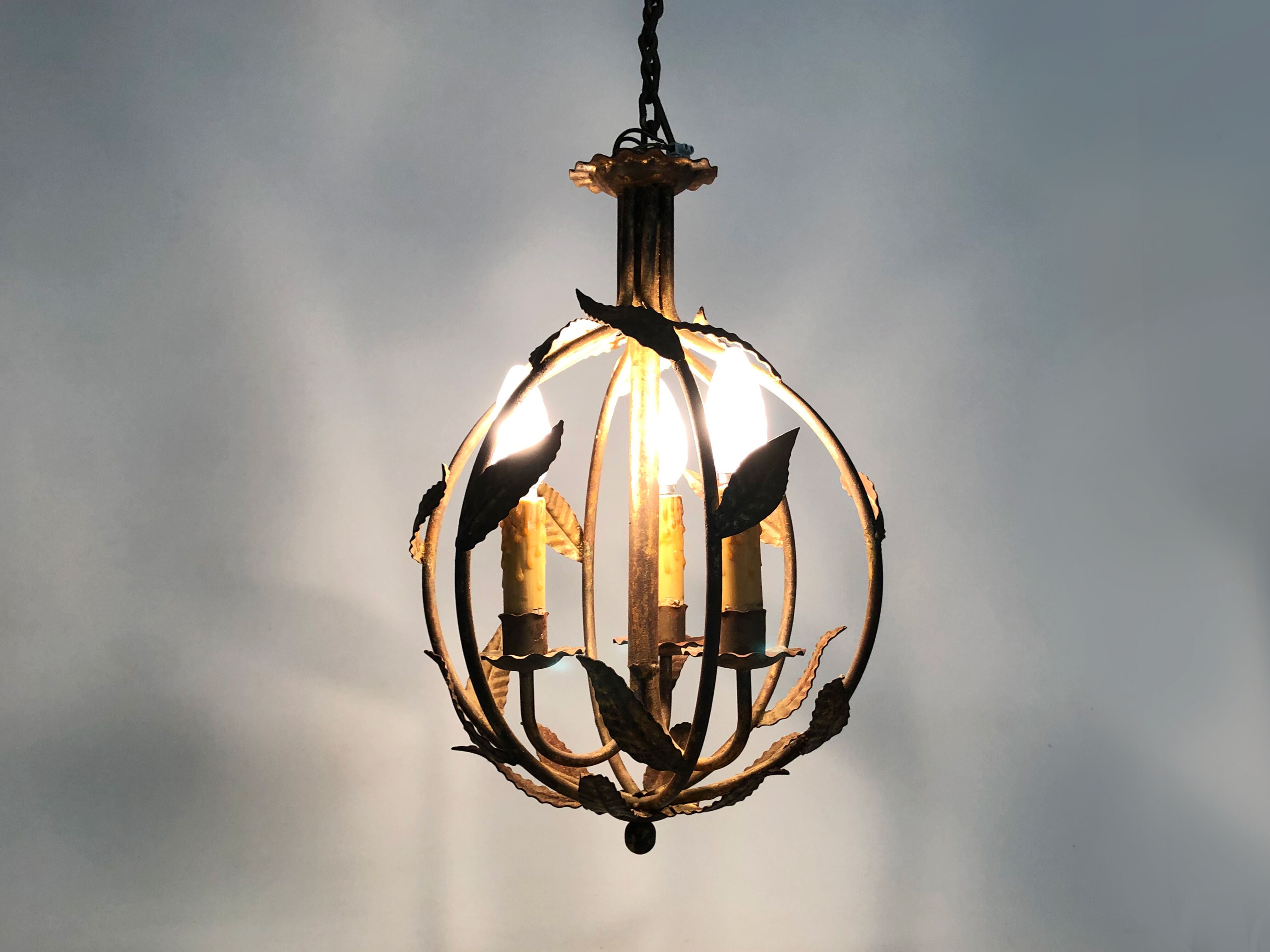 Vintage cage chandelier in aged golden metal and foliage, antique lighting, 3-burner chandelier. Year 60