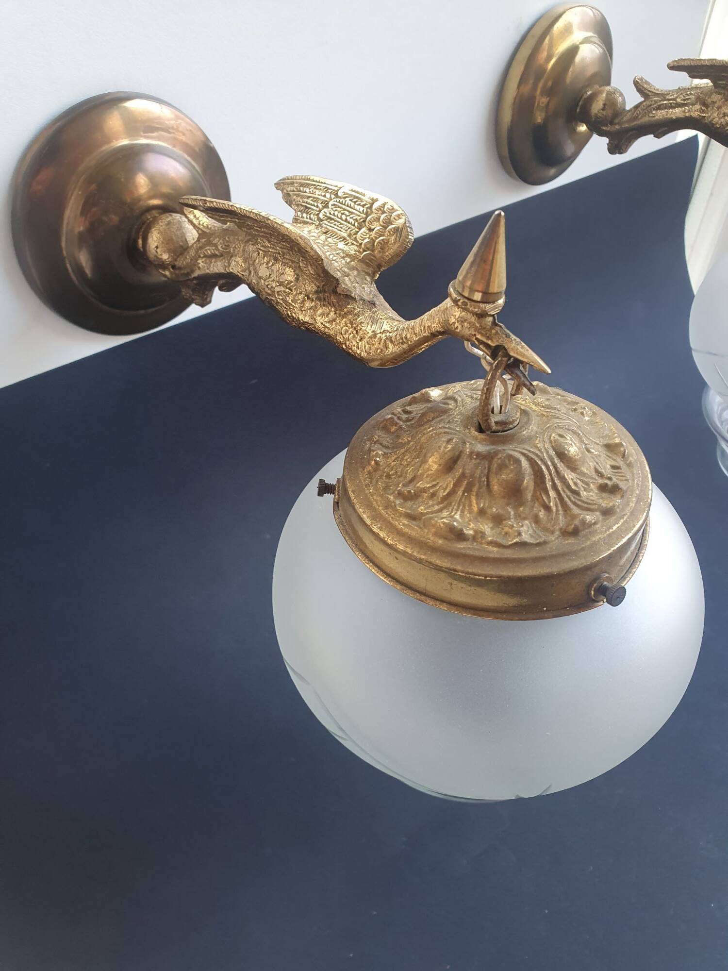 Pair of antique bronze wall sconces