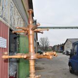 Brown turned beech coat stand, sculpted column, stable tripod.