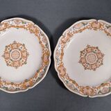 Two 18th century earthenware plates with grand feu decoration in ochre, green and manganese