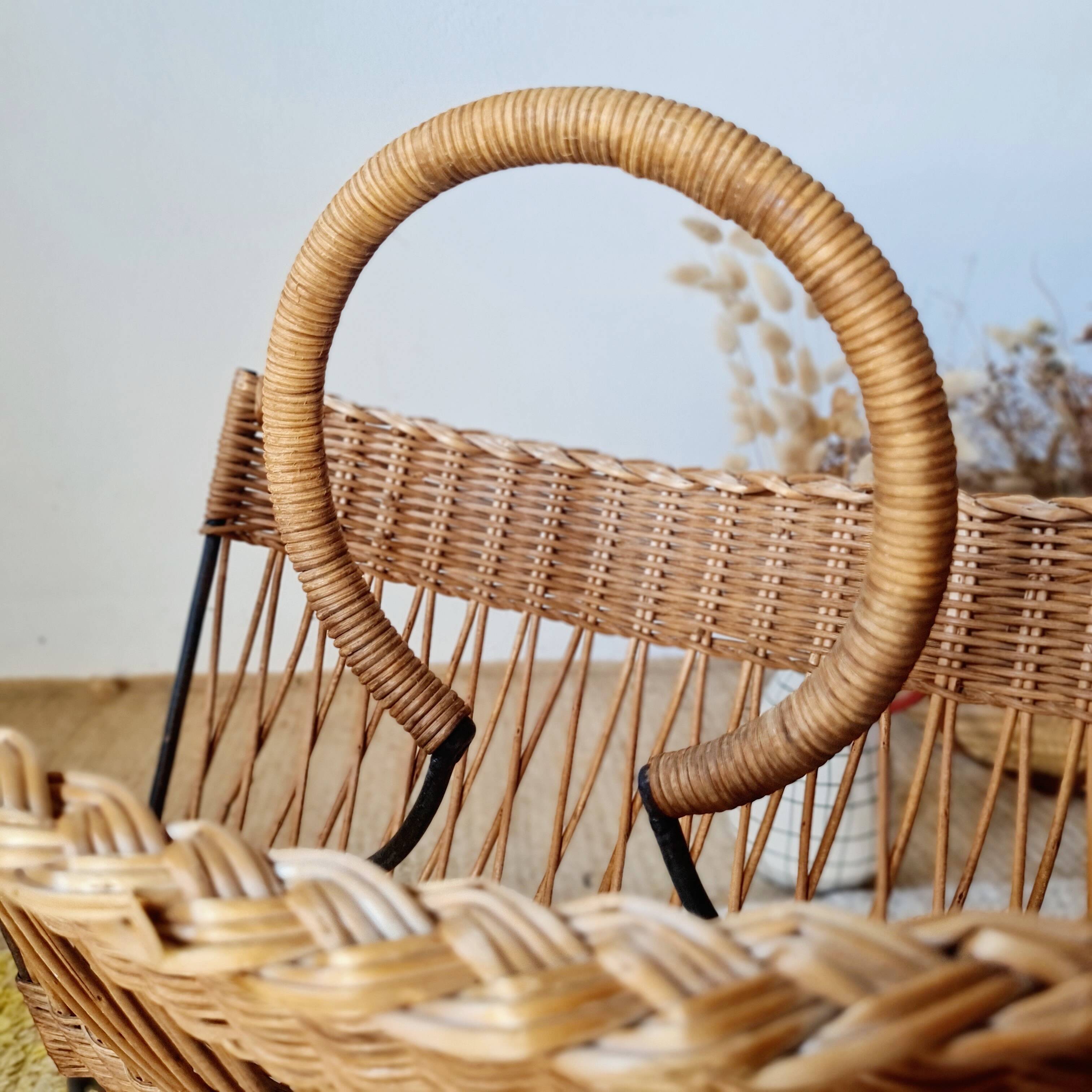 Vintage wicker and metal magazine rack