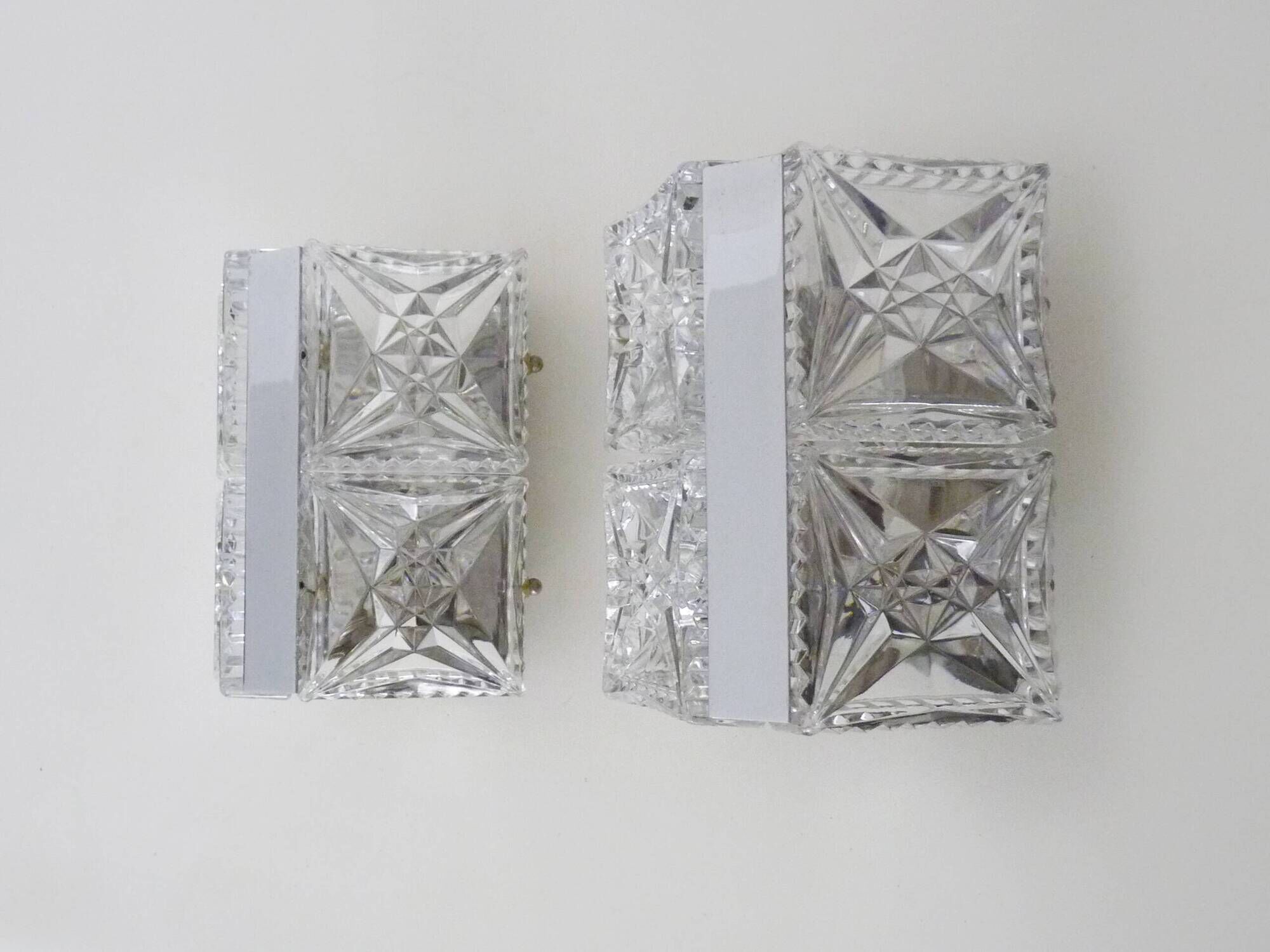 Pair of modernist 1970s glass and chrome metal wall sconces