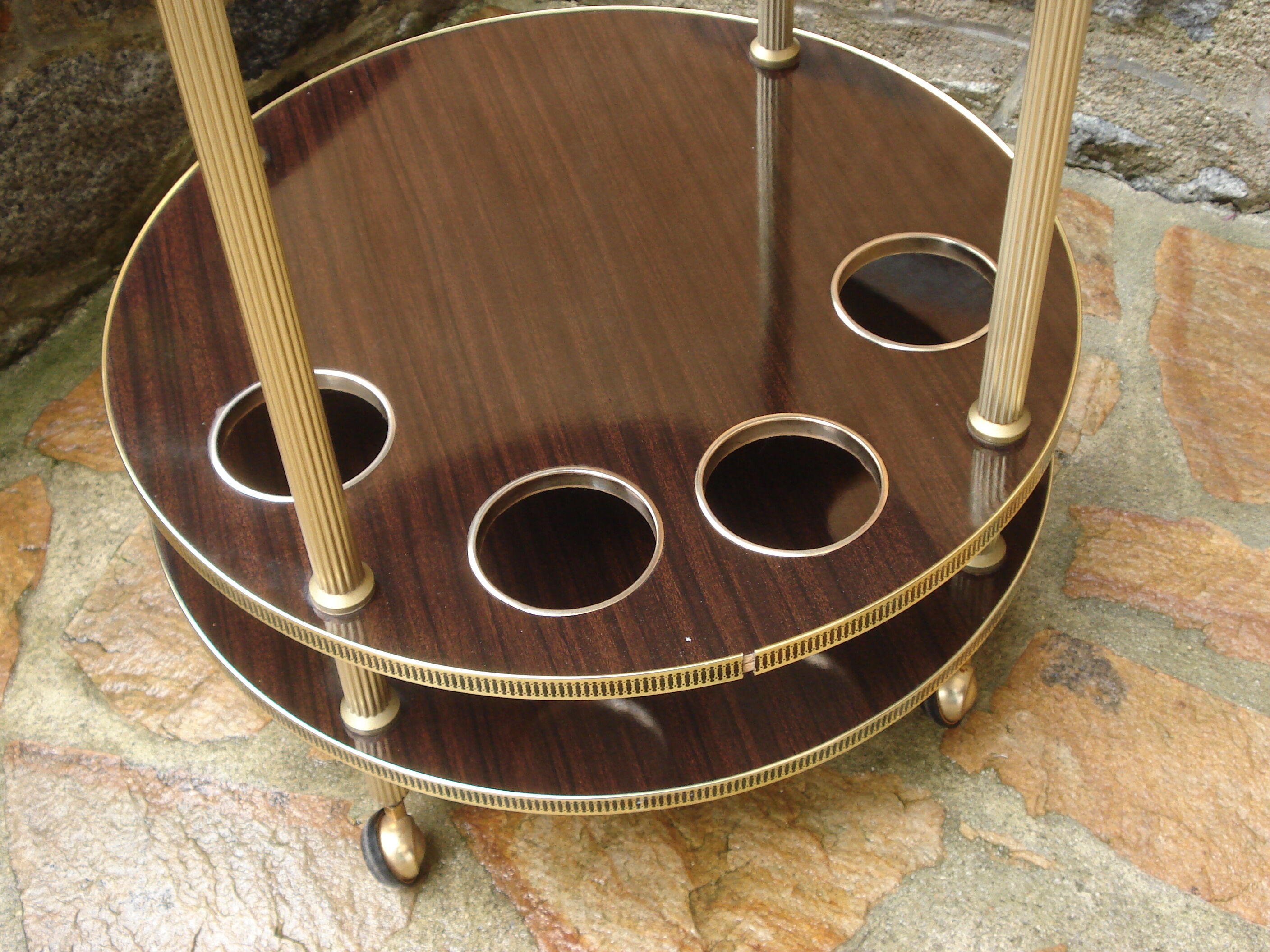 Round "bar" service in gilded metal on wheels and formica trays