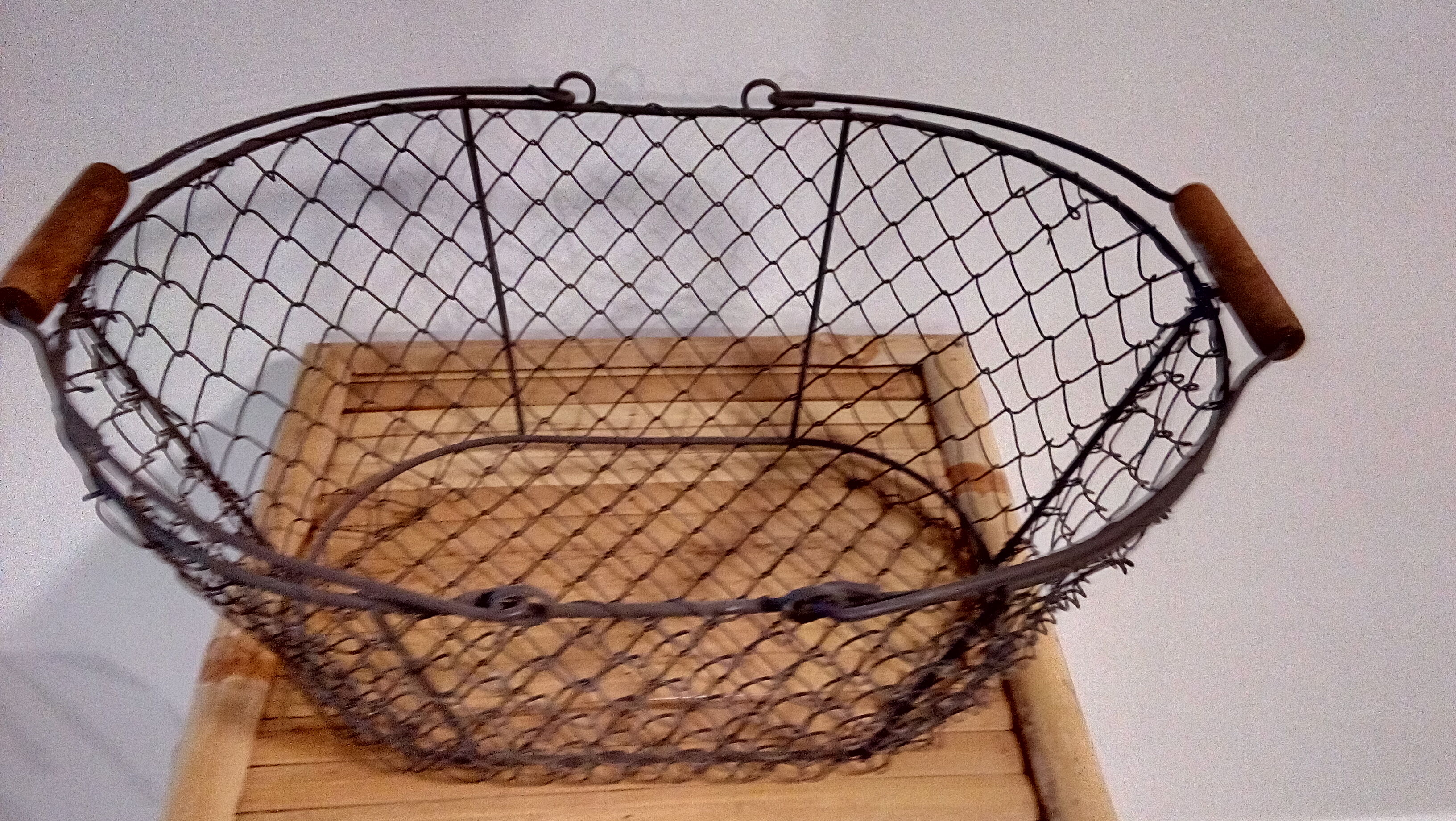 Duo of aged metal mesh baskets