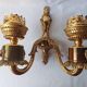 Wall lamp in gilded bronze with a lion's head and engraved globe.