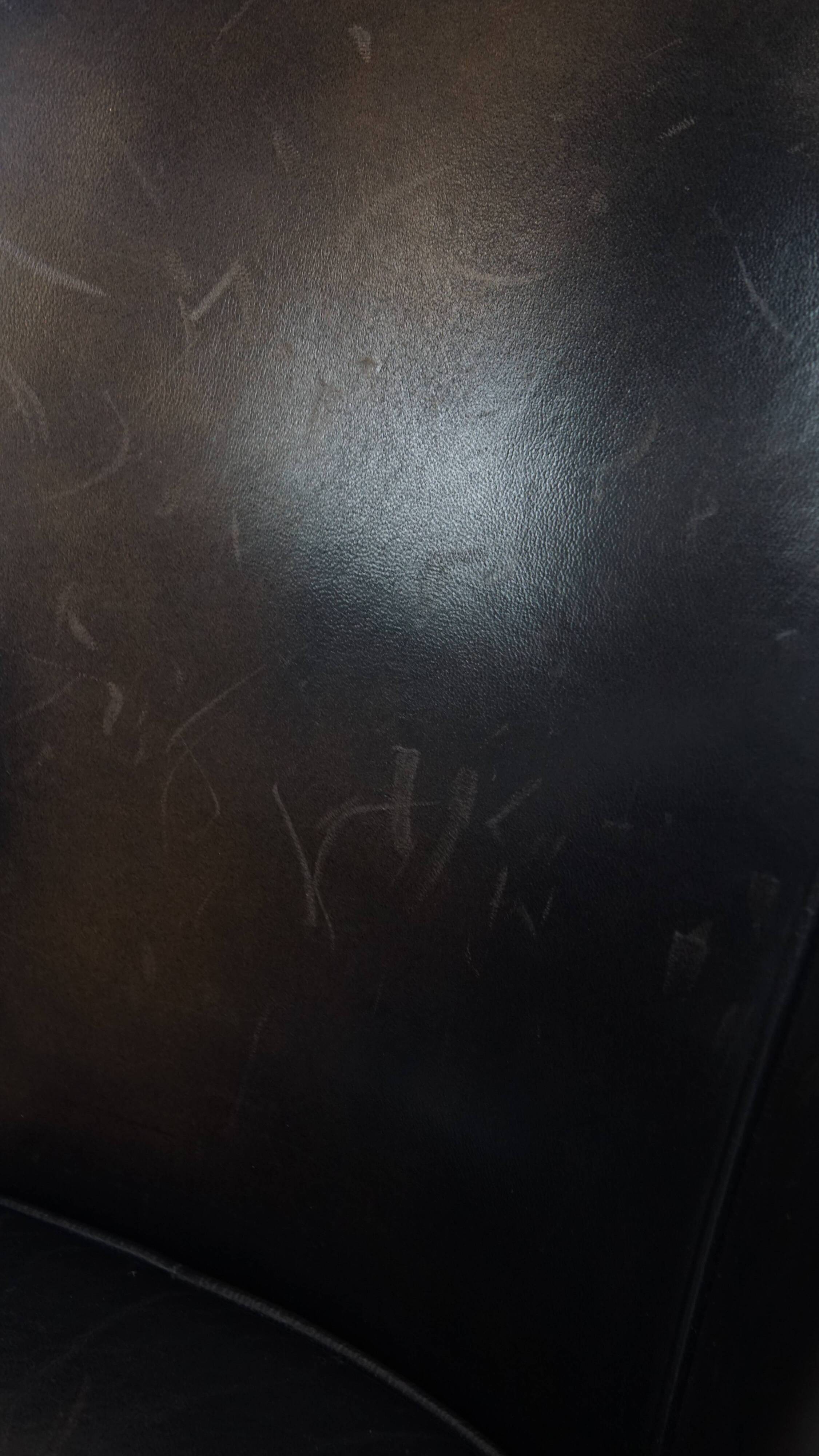 Fauteuil club noir/gris en cuir de mouton