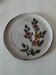 Glazed stoneware plate with floral motif