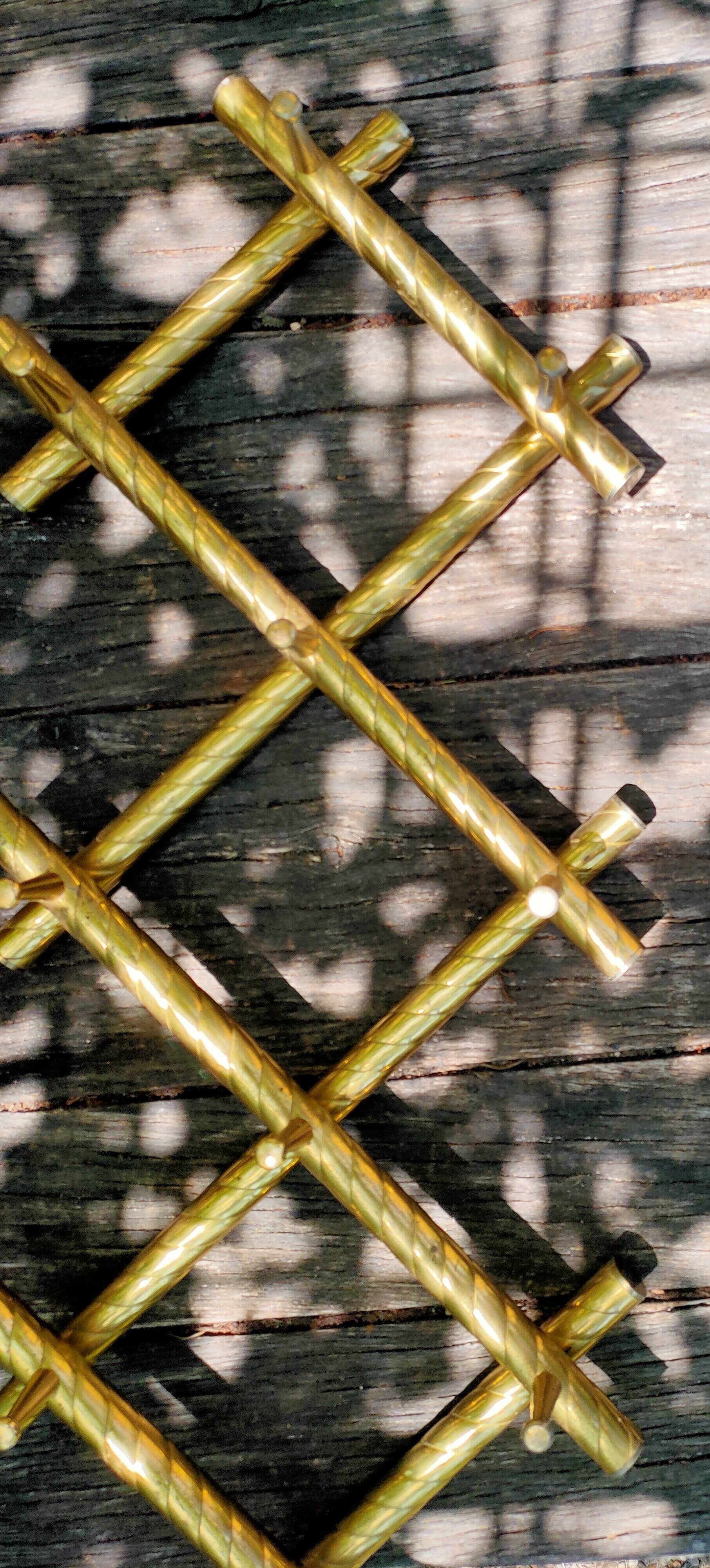 Wall coat rack in gilded metal