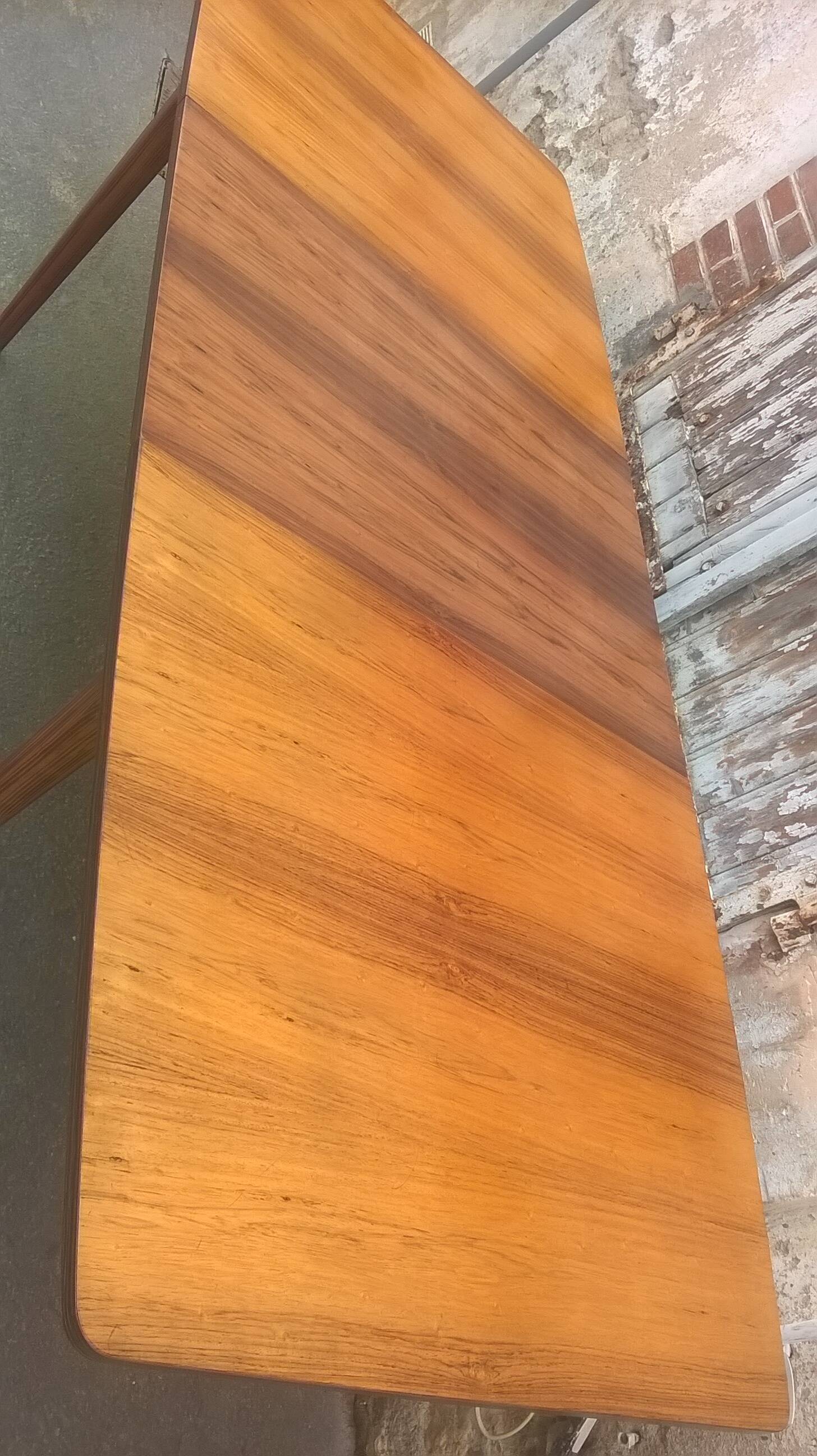 Extendable teak dining table
