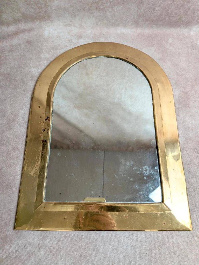 Vintage Moroccan wall mirror in brass, arch shape.