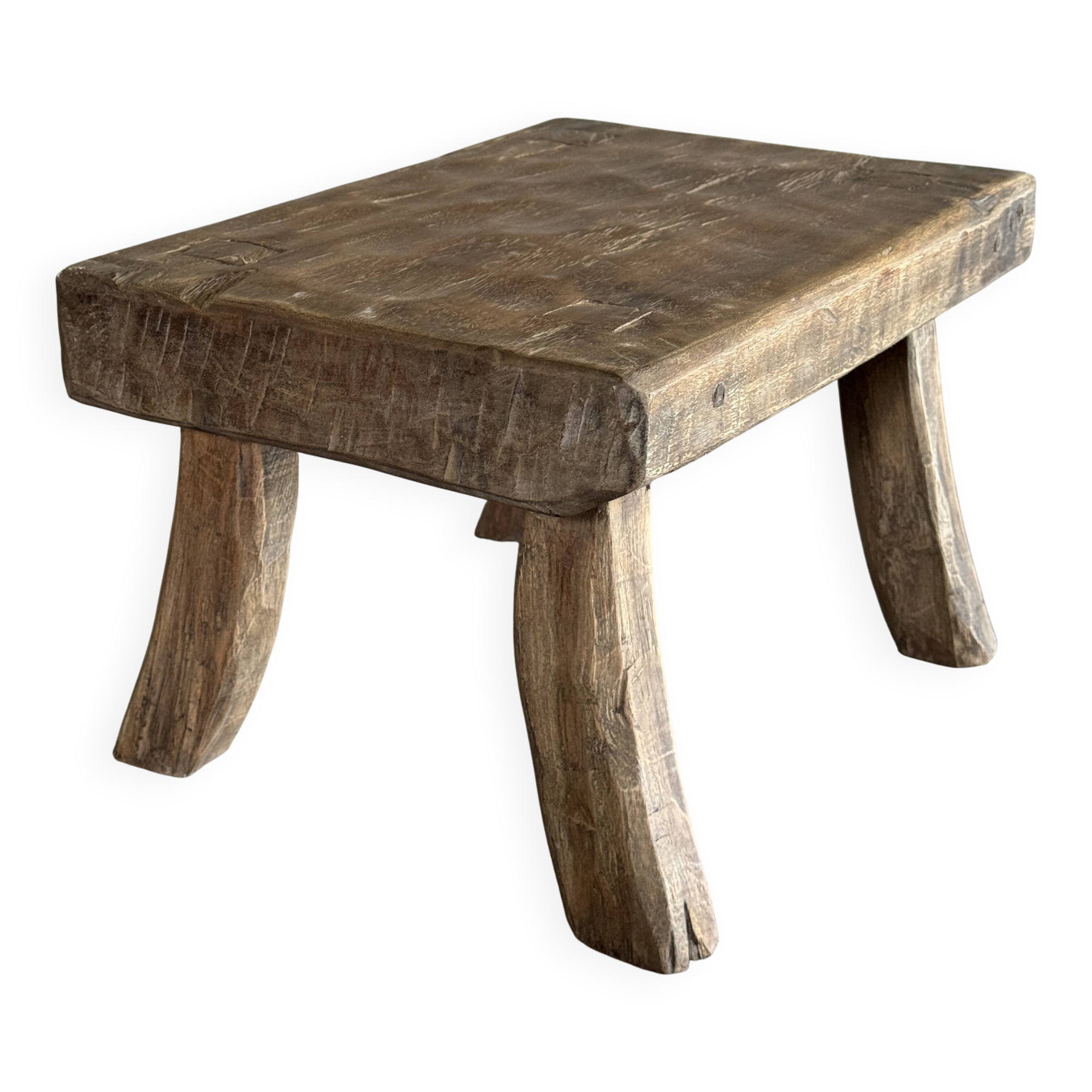 Small stool, rectangular solid teak side table with curved legs.