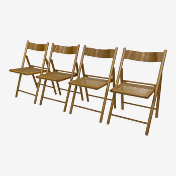 Ensemble de quatre chaises pliantes vintage avec cannage et bois des années 1970