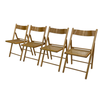 Ensemble de quatre chaises pliantes vintage avec cannage et bois des années 1970