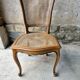 5 old cane-seated solid oak chairs.