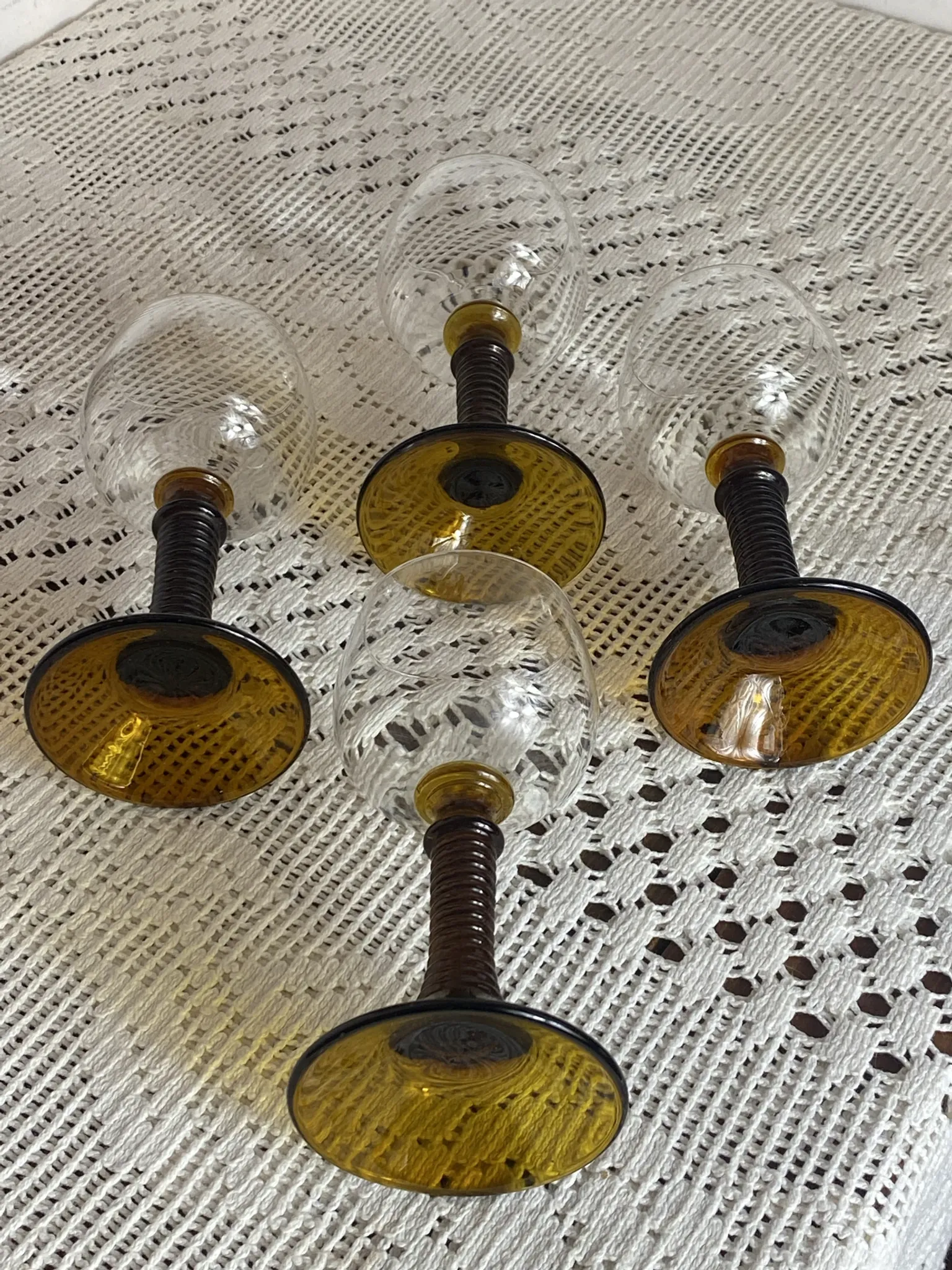 Footed glasses of the Roemer type, amber colour