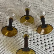 Footed glasses of the Roemer type, amber colour
