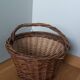 Woven wicker basket with handle