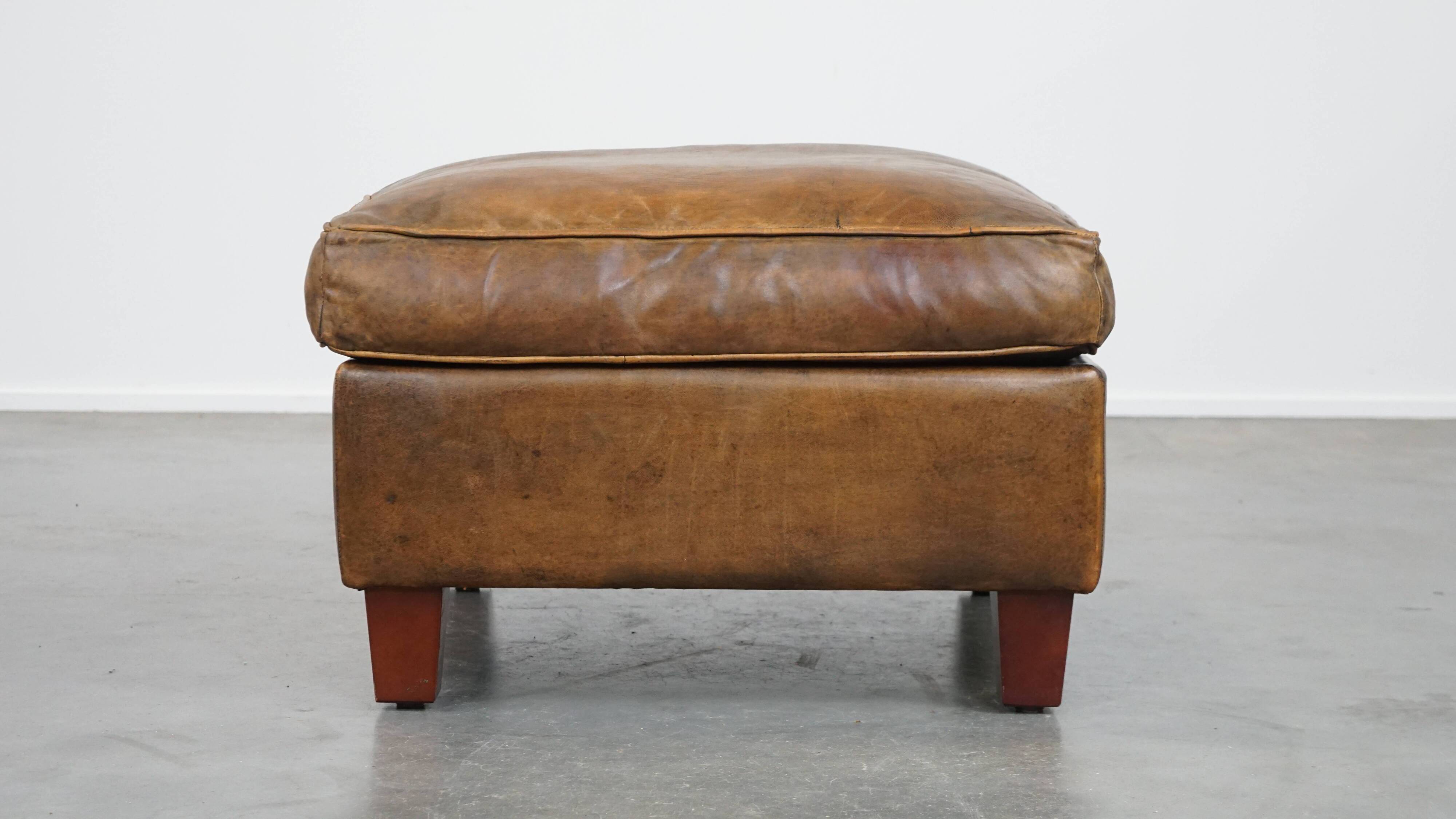 Sheepskin wing chair + XXL patinated footrest